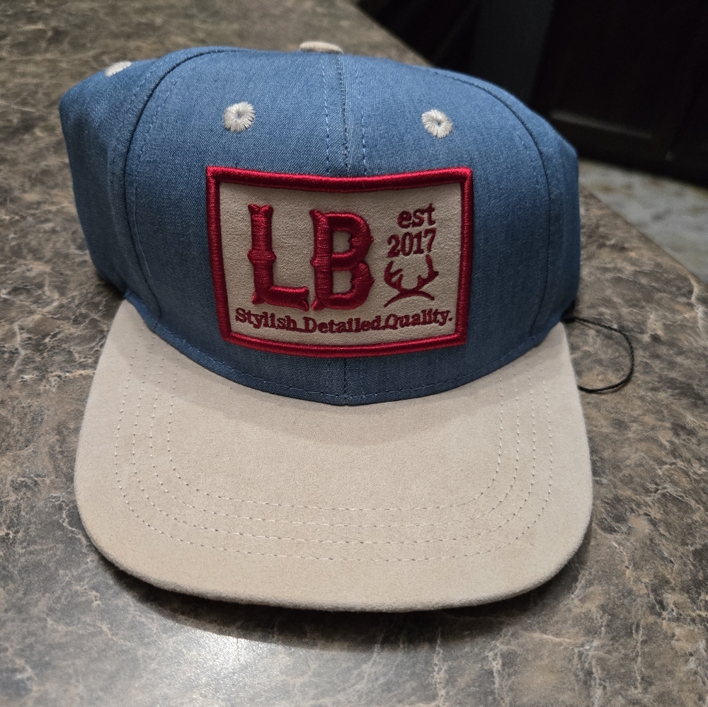 Little Buck 9- 18m Blue and Tan Cap with Red Embroidery *NWOT*